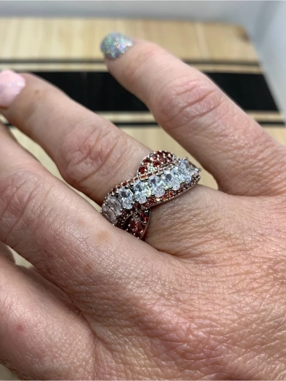 Simulated White & Red Diamond Criss Cross Statement Ring Silvertone